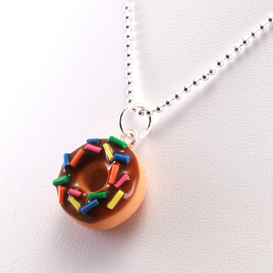 Load image into Gallery viewer, Scented Jewelry ~ Tiny Hands Scented Chocolate Sprinkles Donut Necklace!
